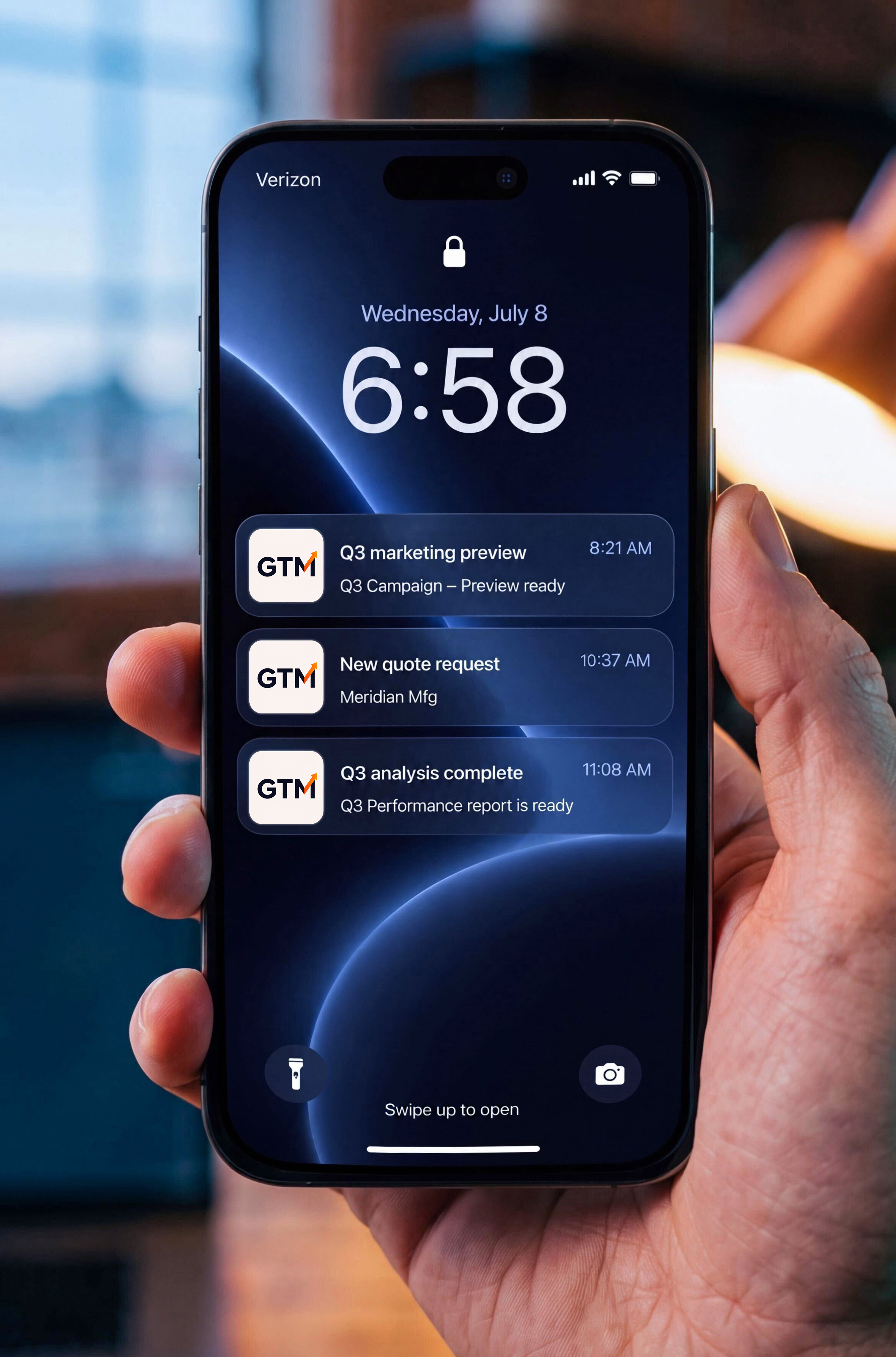 Hand holding smartphone displaying RunYourGTM campaign analysis and booked demo notifications